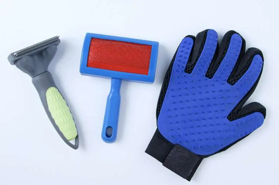 image of grooming tools used for combing dogs that are shedding fur